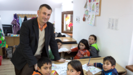 Children with their teacher after school, Romania.