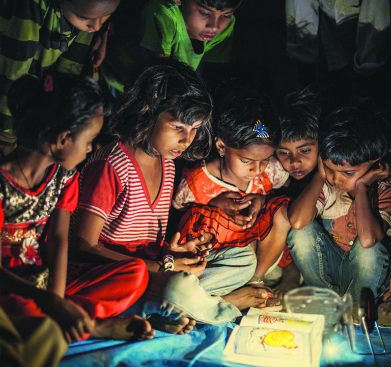 Children at an evening reading session in an Indian village. © Sayantoni Palchoudhuri/ International Finance Corporation (IFC) Children at an evening reading session in an Indian village. © Sayantoni Palchoudhuri/ International Finance Corporation (IFC)