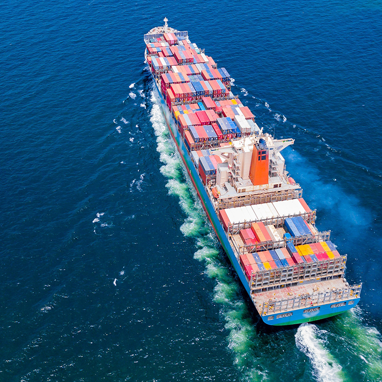 Container ship sailing across the ocean. Photo: Adobe Stock