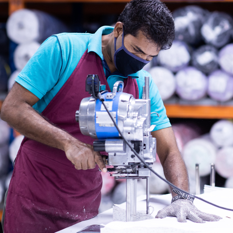 Image of a man manufacturing in a textile industry