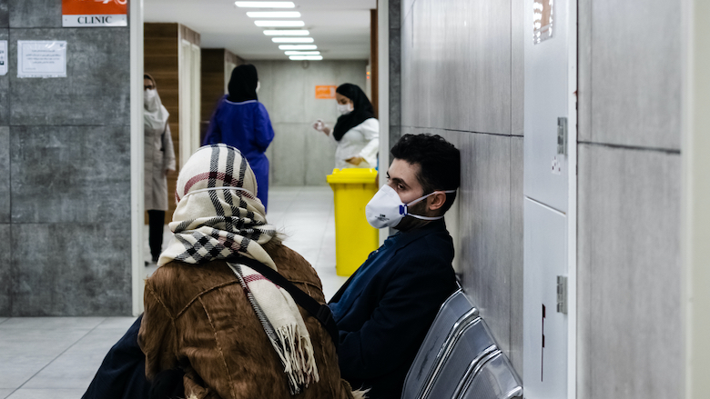 A young man and his wife wait for a coronavirus test in a hospital in Tehran, Iran.