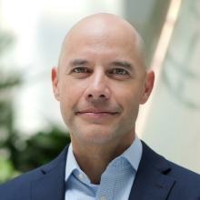Professional headshot of Nikolas Myint
