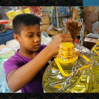 A boy locking oil commodity 
