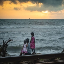 Family sitting at a Sri Lankan beach