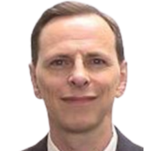 Image of white man, light brown hair, gray suit