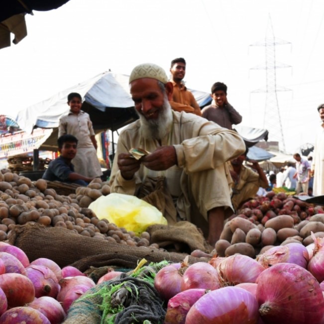 Farmer selling produce at market