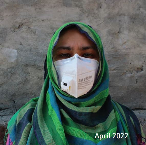 Pakistani woman with covid mask and green head scarf