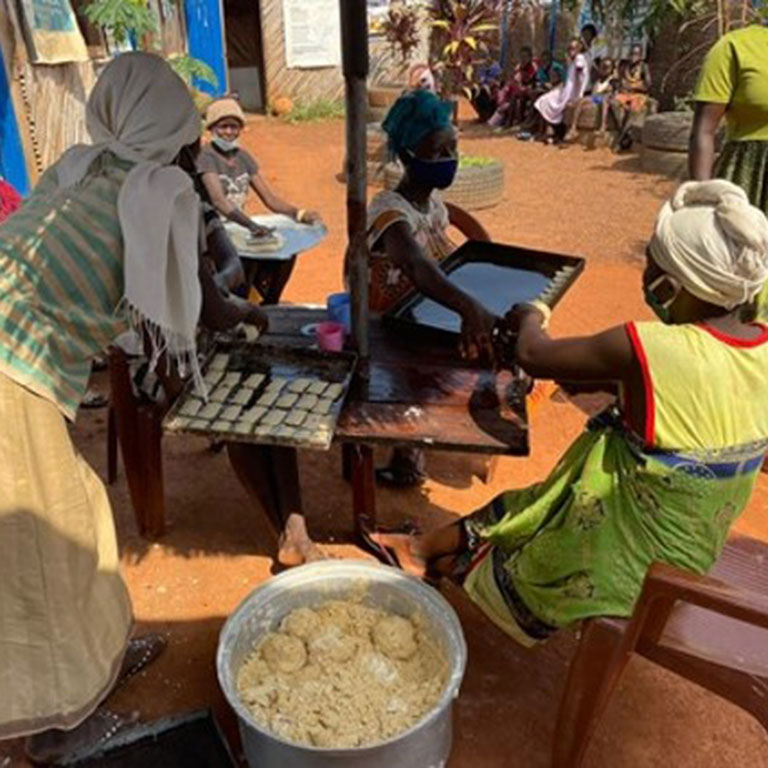 Women entrepreneurs make biscuits to sell at a site for Internally Displaced Persons in Wau, Western Bahr el Ghazal State in 