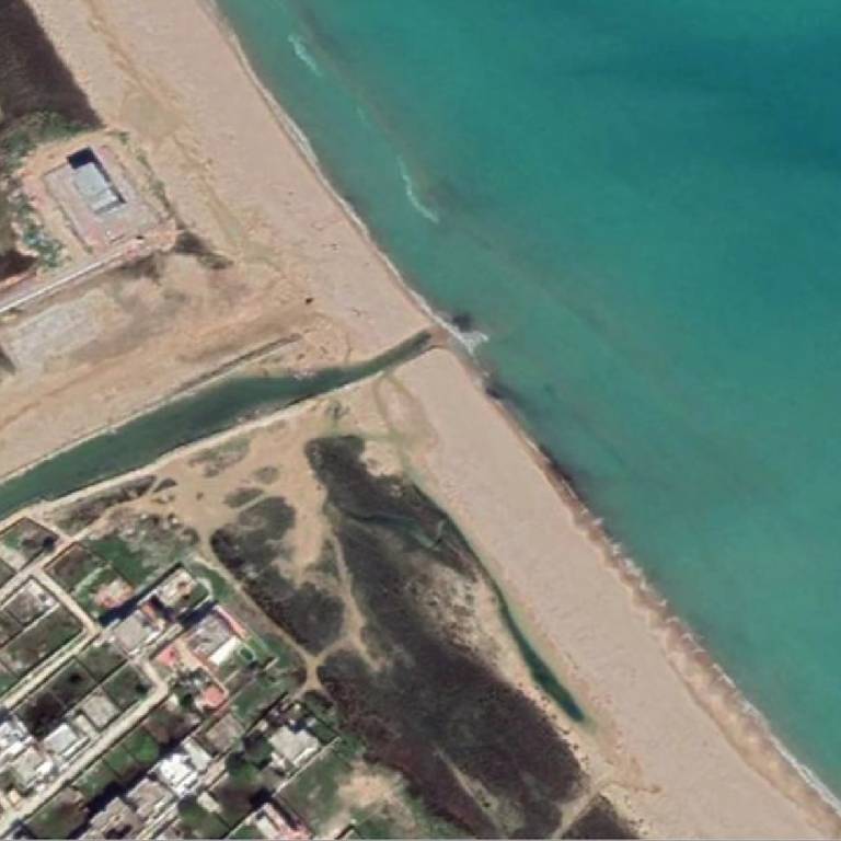 An aerial view of the Tunisian coastline shows cleaner beaches and water, thanks to a wastewater recycling project.
