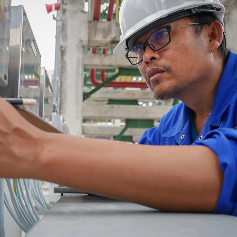 Asian man working in electrical