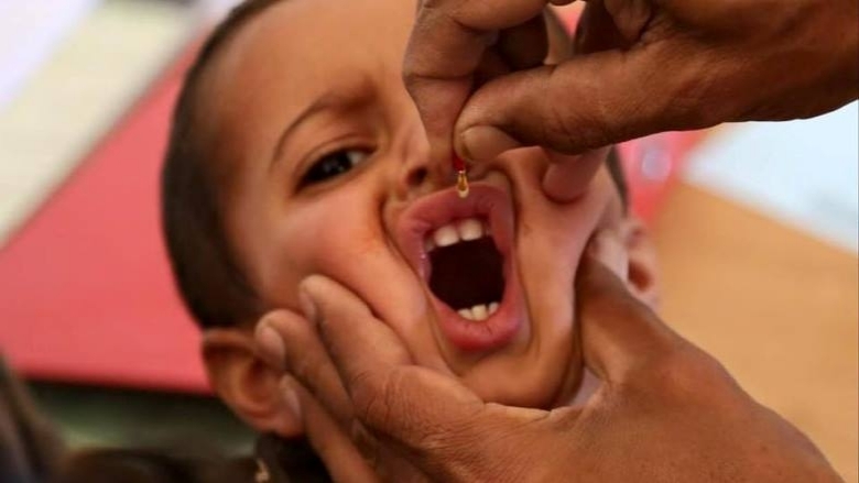 Child receiving polio vaccine (UNICEF)