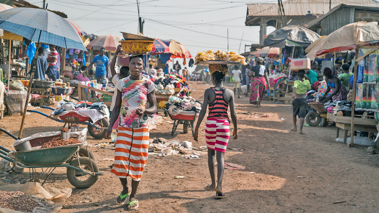 People walking through a market in Freetown, Sierra Leone