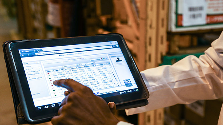 A man in Kenya demonstrates a logistics management information system. Photo: Sarah Farhat/ The World Bank