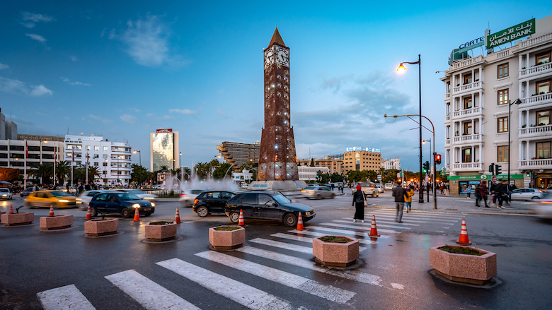 Cars circle a roundabout on Habib Bourguiba Avenue in Tunisia.