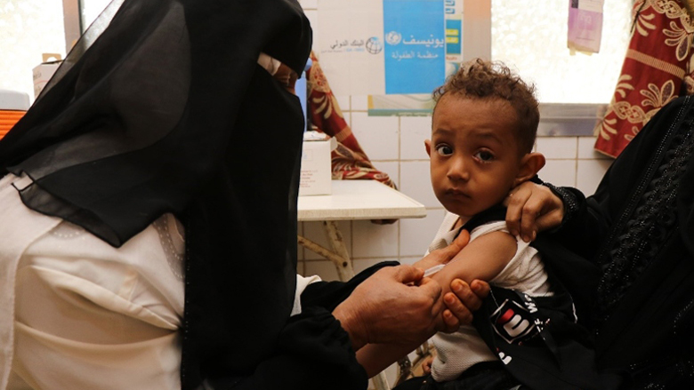 Mohammed Mushtaq, 3 years old, being vaccinated against measles in the Maternal and Child Health Centre in Abyan Governorate, Yemen
