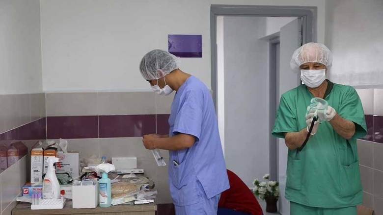 Health care workers sanitize equipment at a hospital in Morocco.