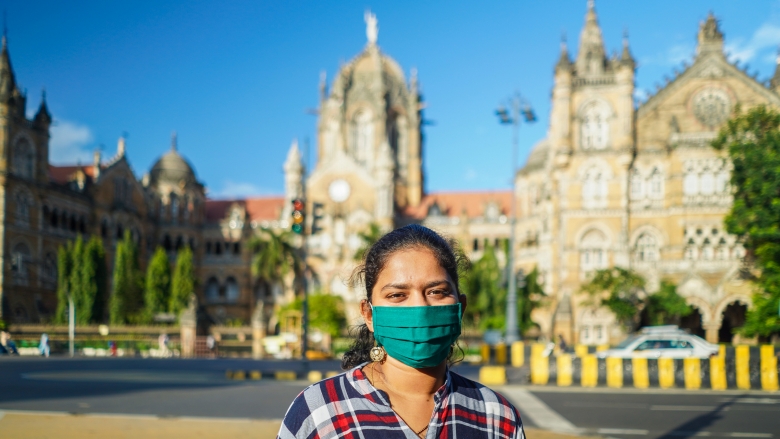 A young Indian woman wearing a mask in Mumbai. Photo credit: Kunal Umesh Mohite/Shutterstock.com 