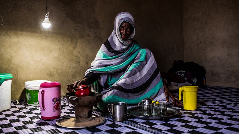 Woman in Senegal preparing tea