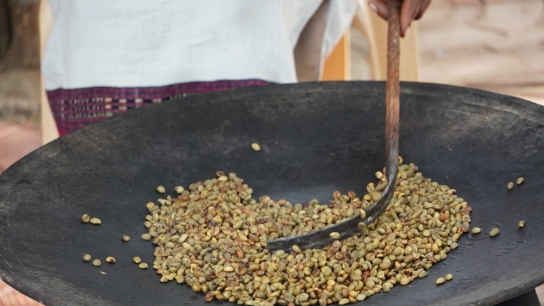 Wild Arabica coffee beans being roasted.