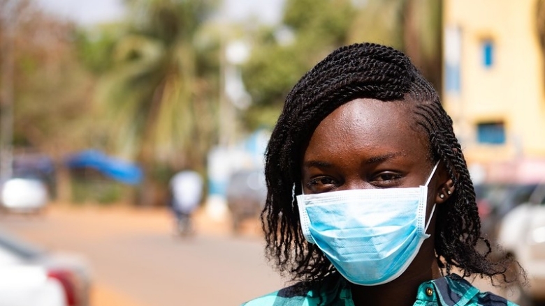 Girl wearing mask to protect against COVID-19