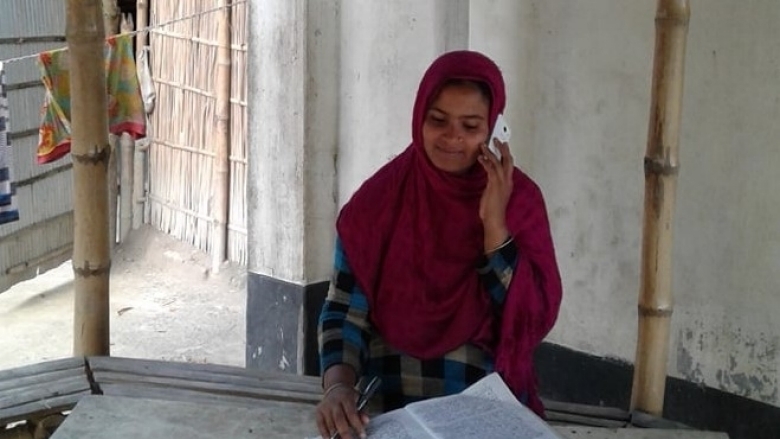 A woman speaks on her cell phone