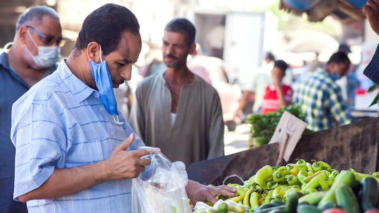 Sellers and buyers wear medical face masks in the outdoor bazaar in Hurghada, Egypt.