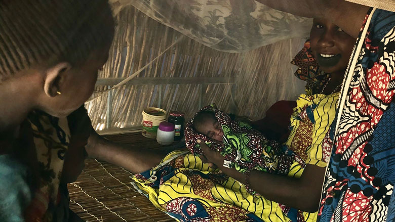 Originally from Podor in the far north of Senegal, Kaffia Diallo accompanied her pregnant daughter as she moved her herds and helped her give birth to a baby boy in their camp near Kaffrine, almost 300 km to the south. Photo: © Elena Queyranne/World Bank