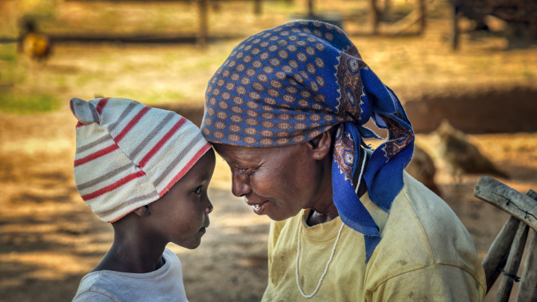 Child with her grandmother in a village in Botswana