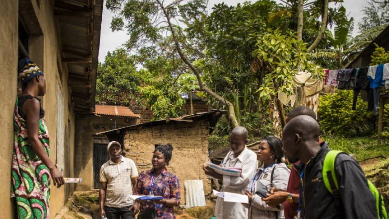 Community representatives visit a family in the Democratic Republic of Congo