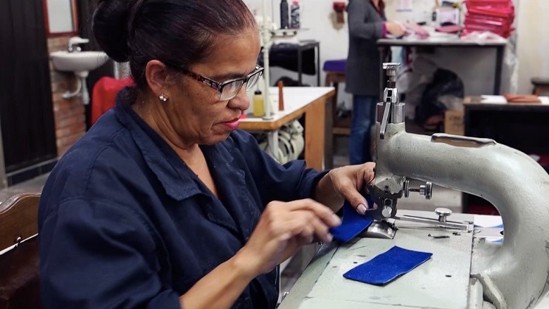 Woman worker in leather goods factory in Bogota, Colombia