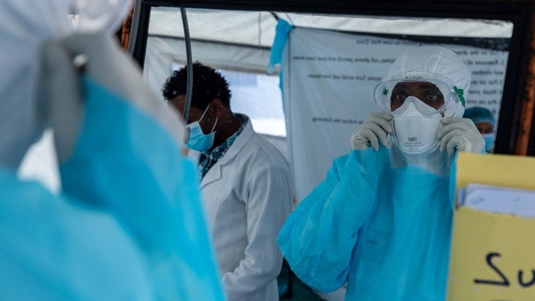 Health care workers inspect their personal protective equipment at an isolation center in Addis Ababa, Ethiopia. Photo: © Mulugeta Ayene/UNICEF Ethiopia