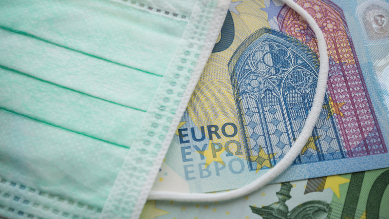 Health mask over Euro currency
