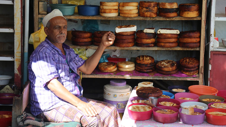 A Yemeni man sells cheese in the popular Al-Shanini market in the city of Taiz; Yemen.