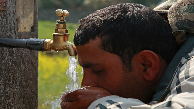 an image of a man drinking water