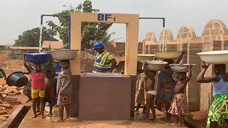 A photo of children collecting water in Benin