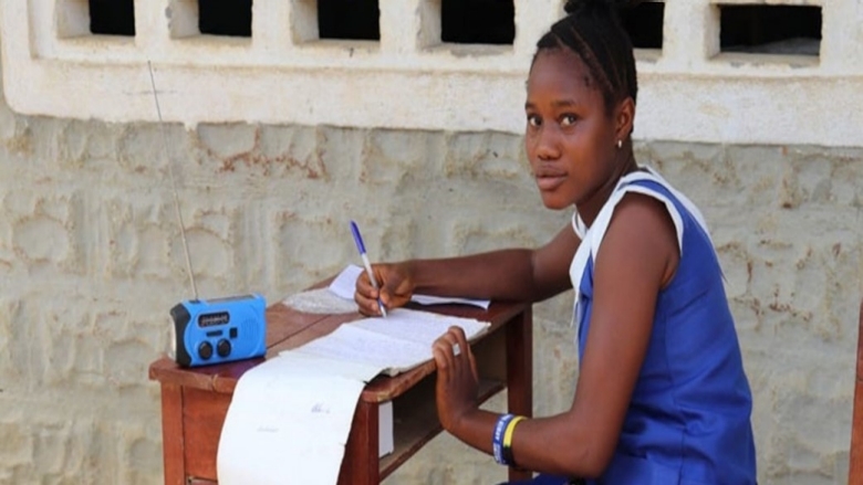 A student engaging with Sierra's Leone education radio program