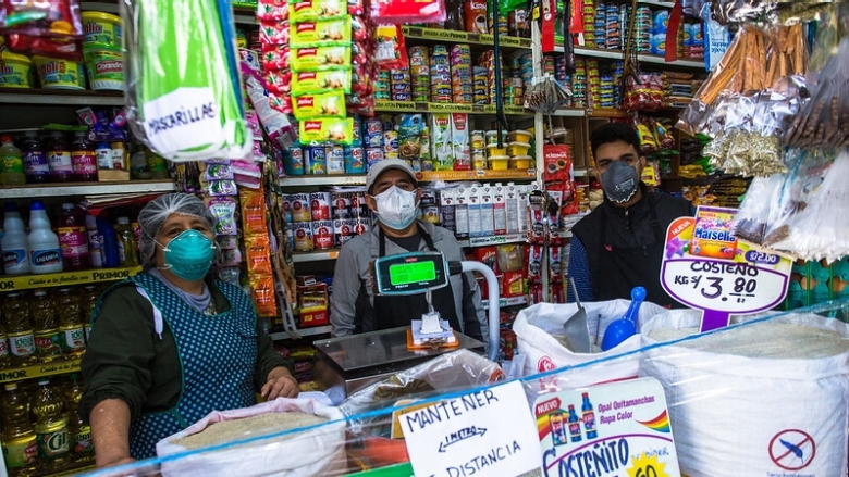 Family from Peru in their food store in times of Covid19