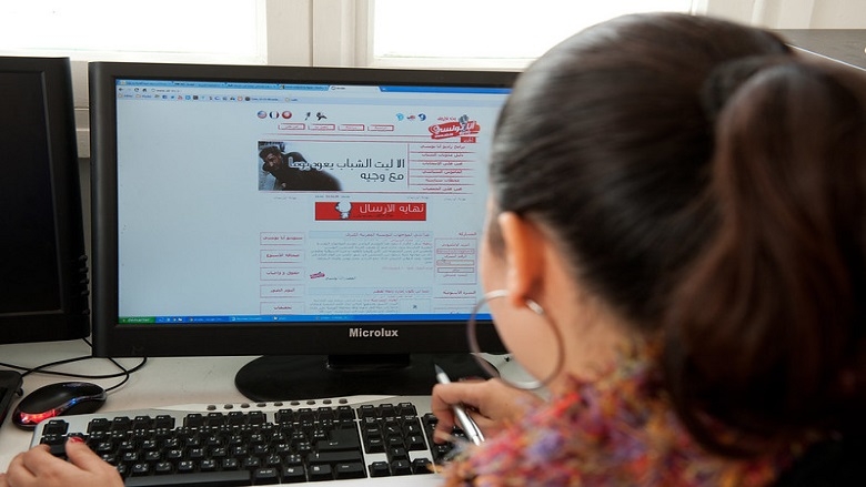 Young woman working at a computer