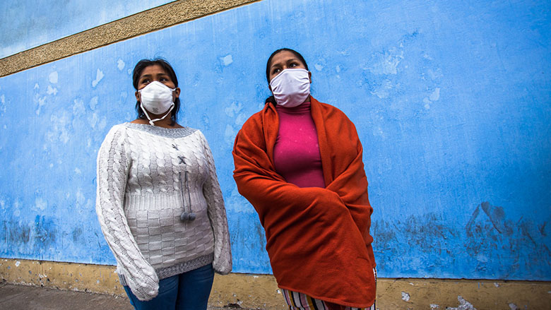 Two women stand outside the Luis Negreiros Hospital, in Callao, Lima, Peru