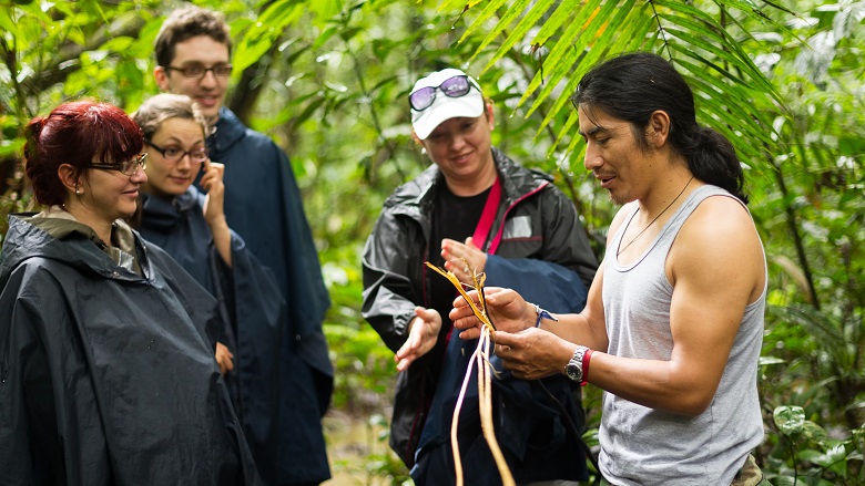 Naturalist Local Guid With Group Of Tourist In Cuyabeno Wildlife Reserve Ecuador