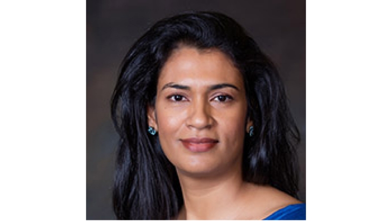 Female with long black hair and blue blouse