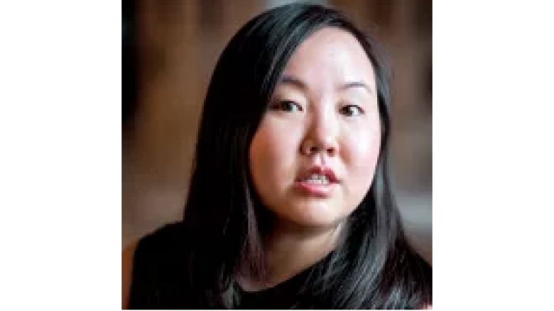 Female with long straight hair wearing black blouse