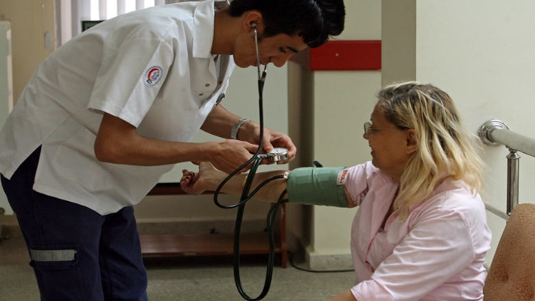A patient receives an intial vital signs check before seeing the doctor