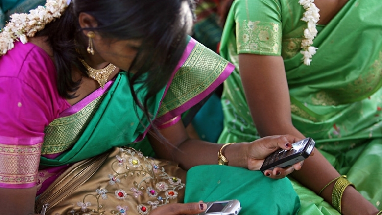 south asia women uses her phone