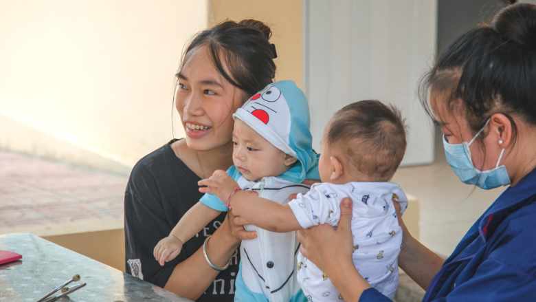  Mother and children receive care at a local commune health station in Yen Bai, Vietnam