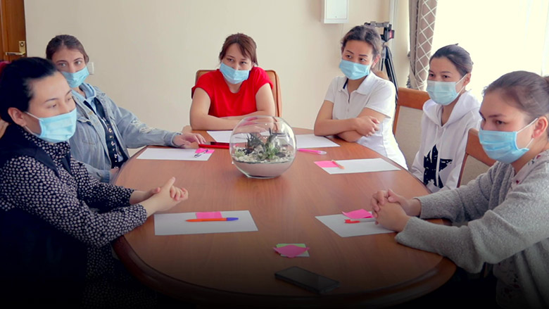 Medical workers sitting around a desk