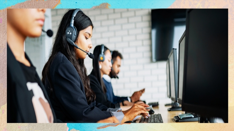 A female receptionist working at customer service helpdesk, talking to clients on helpline support at call center