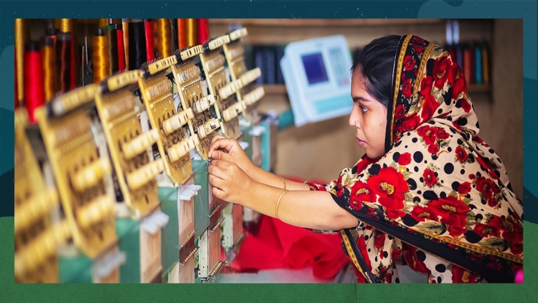 A woman garments worker working with Computerized Embroidery Machine at Madhabdi, Narsingdi, Bangladesh