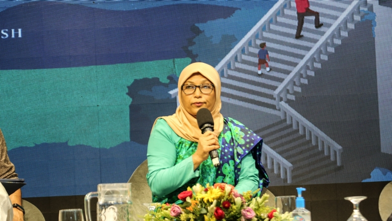 Female speaker wearing hijab on stage
