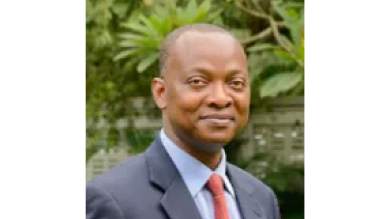 Male wearing blue suit, powder blue blouse and red tie